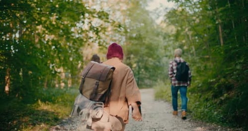 Woman Carrying Backpack While Exploring Forest