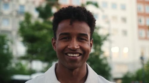 Young man changing facial expressions in urban city