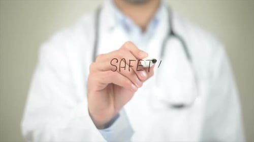 Doctor Writes 'Safety' on Transparent Screen
