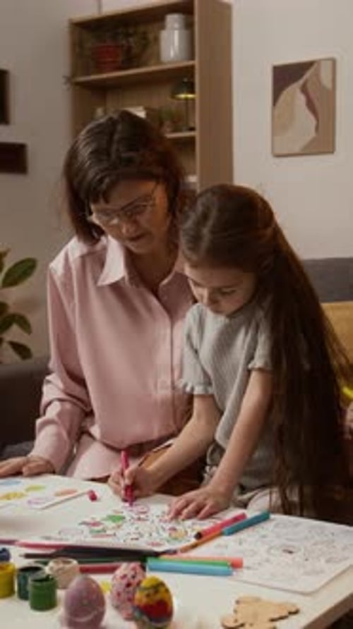 Woman Coloring with Two Children at Home