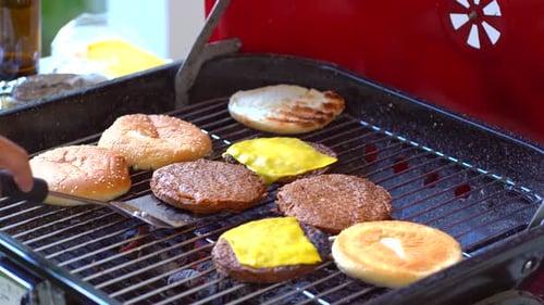 Close up of burger pattys with melted cheese