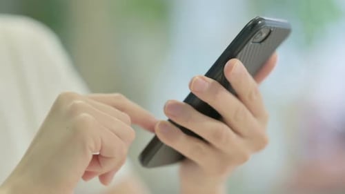 Close up of Woman Browsing Internet on Smartphone