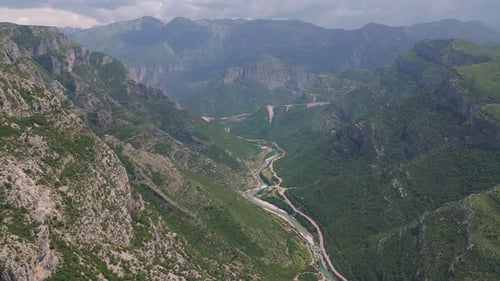 An incredible gorge and an endless mountain panorama stretching into the distance. Atmospheric view.
