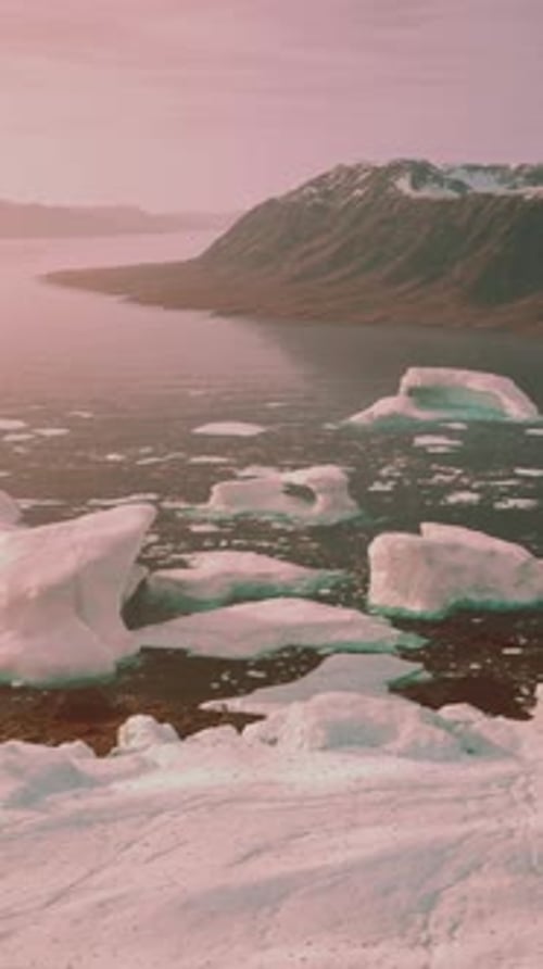 A Stunning View of Icebergs Floating on a Serene Body of Water