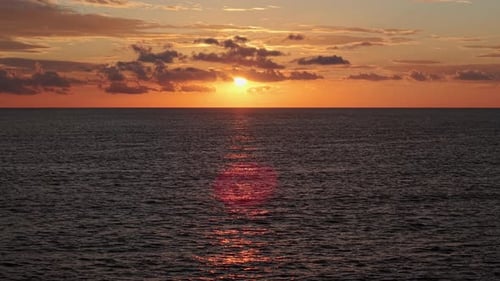 Scenic Sunrise Over the Mediterranean Sea with the Sun Above the Horizon and Warm Light Reflecting
