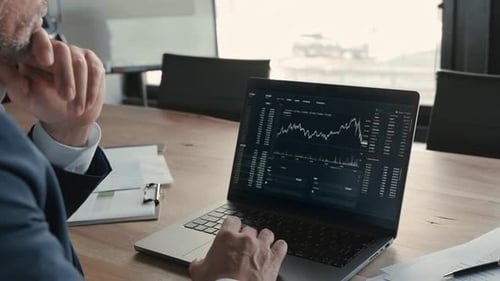 Stock Market Investor Analyzing Crypto Market on Computer Screen Over Shoulder