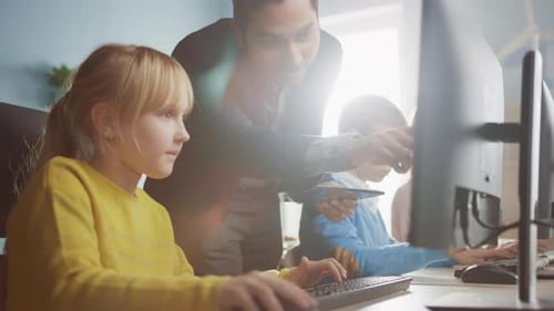 Elementary School Science Classroom: Teacher Explains to a Smart Little Schoolgirl how to use Perso