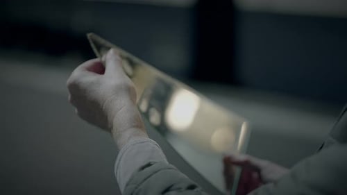 Hands Examine Clear Glass Prism