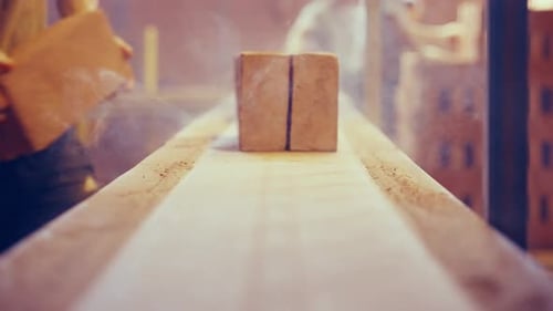 Vintage bricks being put on conveyor belt