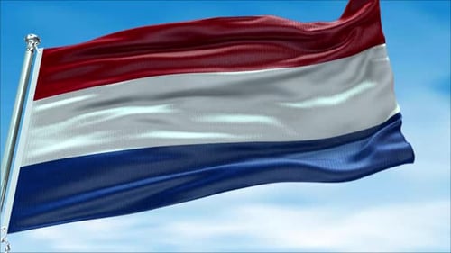 Waving Netherlands Flag Against Blue Sky