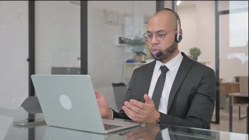 Call Center Employee with Headset Talking with customer Online