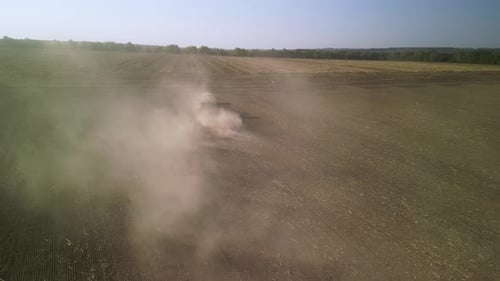 Tractor on the field seeding wheat