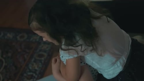 Two Children Hugging Affectionately Indoors