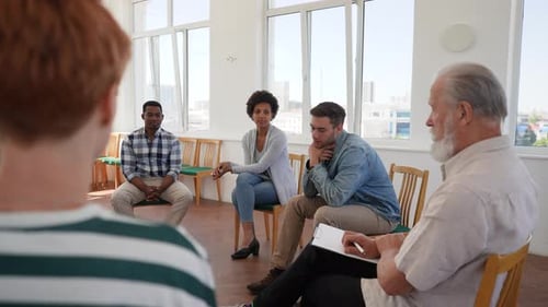 Diverse Group at Therapy Session in Bright Room