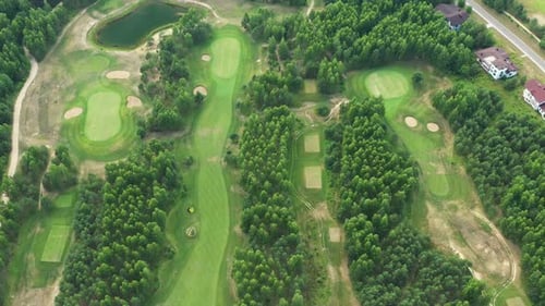 Top View of the Golf Course Located in a Wooded Area
