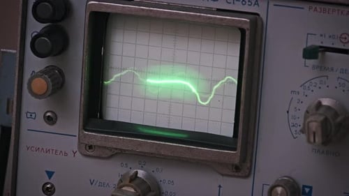 Analog Oscilloscope Showing Fluctuating Green Signal