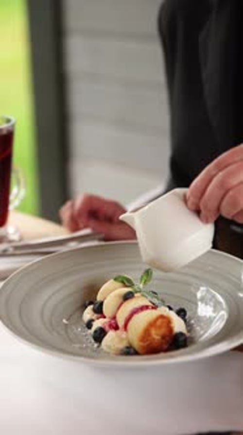 Chef Prepares Delicious Pancake Dessert with Berries