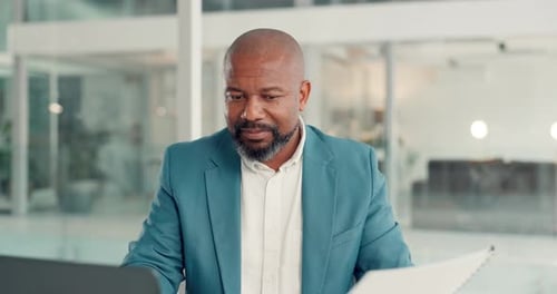 Man Working at Desk in Modern Office Environment