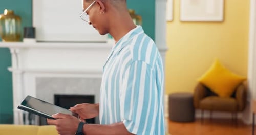Scroll, relax and tablet with man on sofa for online reading, communication and social media post