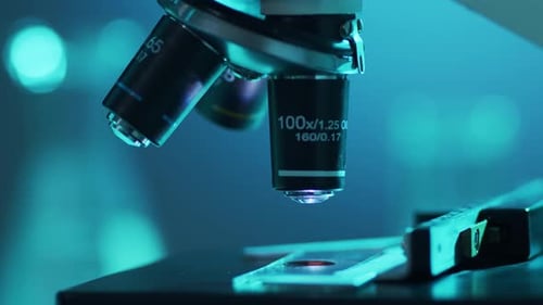 Closeup of Scientific Microscope Laboratory in Hospital Epidemic Disease Healthcare Vaccine Research