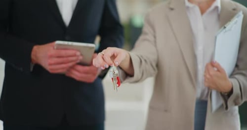 Real Estate Agent Holding Keys to New Dream House