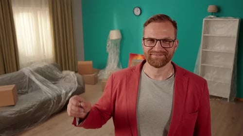 Happy Homeowner Realtor Businessman Holding Keys to New Apartment Selling Apartment and Showing