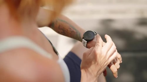 Redhead Female Athlete Checks Smart Watch at Tropical Luxury Outdoor Gym Pro Sportswoman Monitors