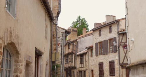 Historic street view of old town Parthenay, France featuring medieval architecture and calm atmosphe