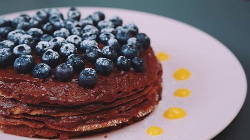 Chocolate Pancake Cake with Blueberries on Plate