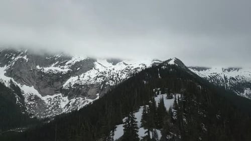 Snowy Mountain Peaks And Forest. British Columbia, Canada.