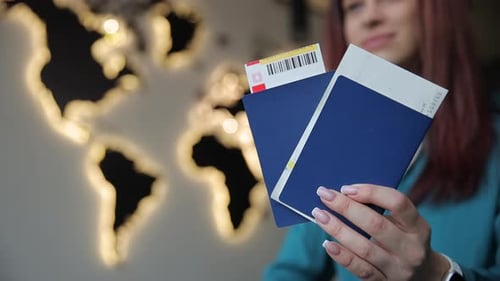 A Woman Holds a Passport Before Departure at the Airport Travel Concept