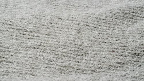 Knitted Warm Grey Sweater or Scarf Macro Close Up Texture Cozy Warm Composition of Wool Fabric