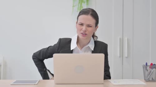 Woman at Desk with Back Pain