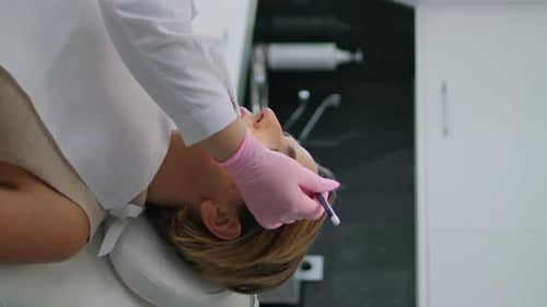 Woman Receiving Beauty Treatment in Medical Office