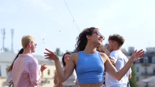 Young Adults Dancing at a Rooftop Party