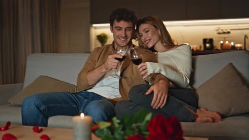 Loving Family Clinking Glasses at Romantic Home Date Spouses Relaxing on Couch