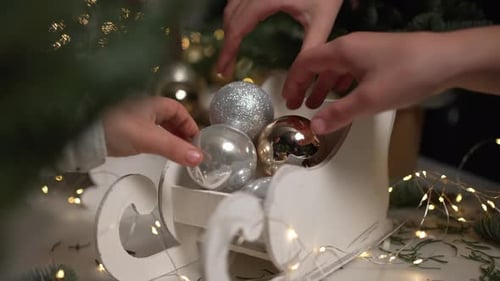 Children Decorating Christmas Ornaments in Sleigh Decoration