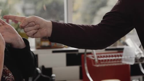 Animated Discussion Between Family in Domestic Kitchen