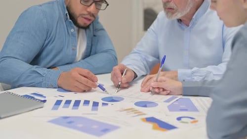 Close up of Office Work by Mixed Race People