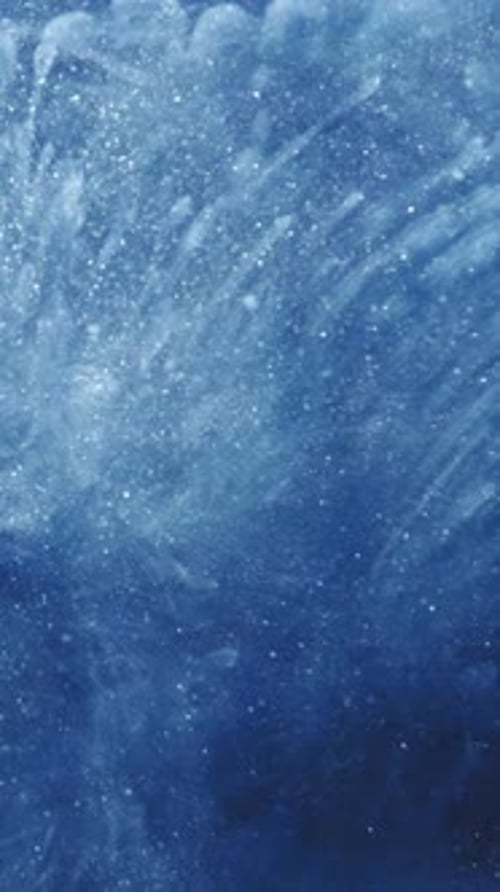 Abstract Swirling Blue Ink with White Sparkles