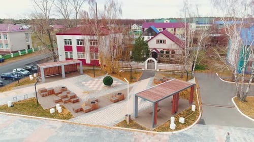 Stylish Wooden Arbor and Benches in Large Urban Park