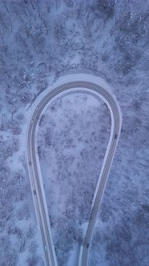 Aerial view of winding road in snow, Japan.
