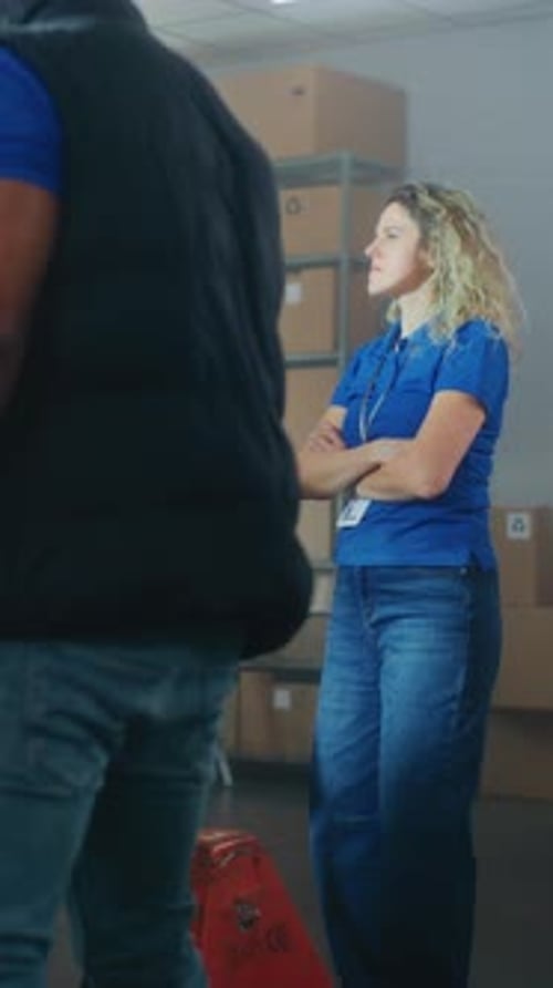 Inventory Specialist Gives Instructions to Warehouse Employees Uses Tablet Computer