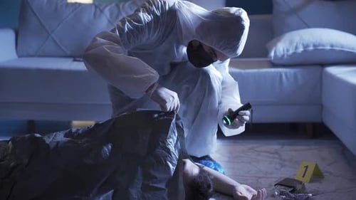 Crime Scene Investigator Examines Body in Bag