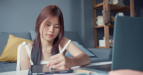 girl teenager with casual use computer laptop focus to learn online write lecture in digital laptop.