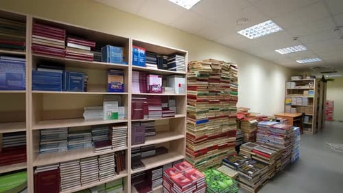 Library books stacks.Bookshelf in library with many books