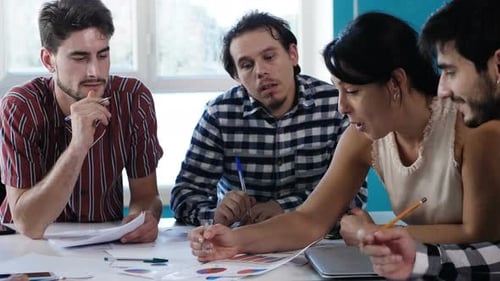 Business Team Analyzing Data in Modern Office