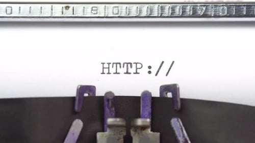 HTTP web word closeup being typing and centered on a sheet of paper on old vintage typewriter mech