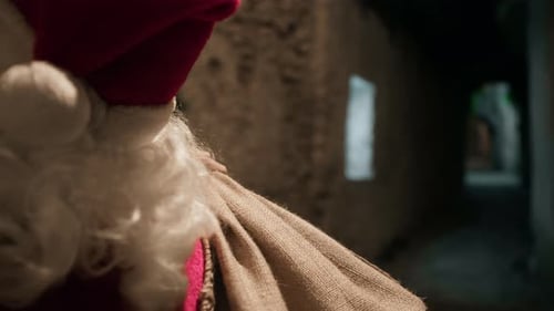 Santa Claus Walking in a Dark Urban Alleyway