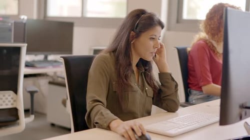 Teleoperator Talking to a Client in a Call Center